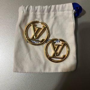 Louis Vuitton gold hoop earrings.